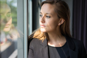 woman looks out the window and considers what to expect during meth withdrawal