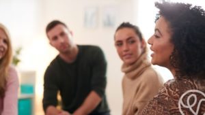 woman talking in group therapy