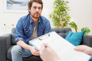 man talks with a therapist in addiction treatment near memphis