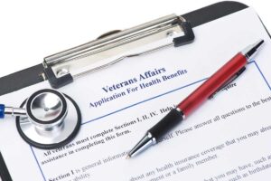 VA form clipped to a clipboard with a pen answers a patients question about does the va pay for addiction treatment
